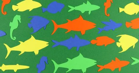 Floating paper colored fish. Stock Photos