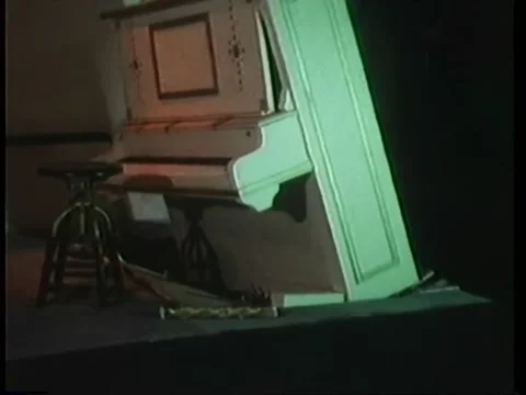 Floating piano exploding and sinking into floor Video stock 260251685