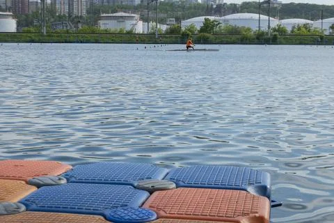 Floating pier made of composite plastic blocks on the river, sea. Plastic b.. 写真素材