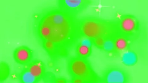 Floating pink blue glowing orbs sparkle against vibrant bright green abstract Stock Footage 345218222