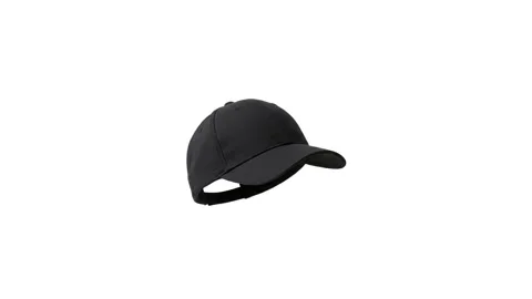 A floating plain black cap isolated on white Stock Footage 339340938