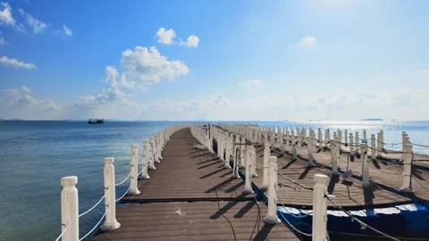 Floating plastic dock pier in the sea. Stockbeeldmateriaal 274371640