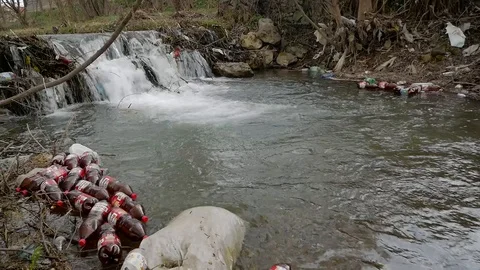 Floating platic beer bottles i Stock Footage 106798693