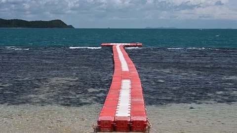 Floating Pontoon Pier Extending into Tropical Sea 4K Stock Footage 340495653