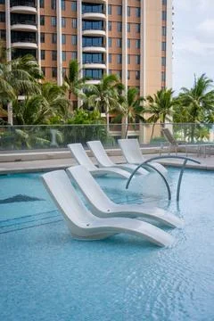Floating pool chair Stock Photos