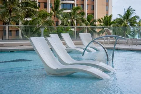 Floating pool chair Stock Photos