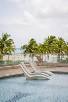 Floating pool chair Stock Photos