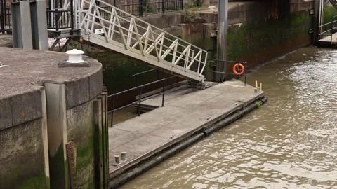 Floating port platform with stairs, moving on waves Stock Footage 219679086