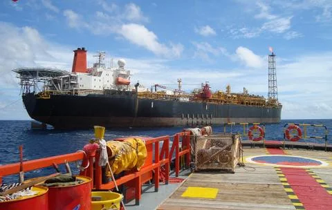 A floating production storage and offloading (FPSO) unit at work off the shore Stock Photos