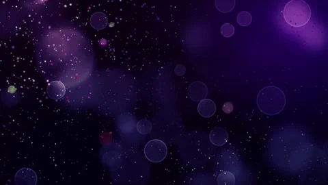 Floating purple bokeh particles and glowing light orbs drifting through dark 스톡 동영상 345331012