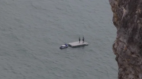 Floating Raft with Two Men and Jet Ski Stock Footage 41245838