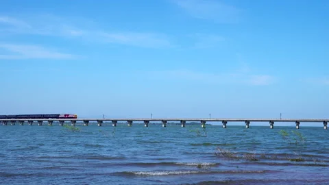 Floating railway in the lake with train run pass through Stock Footage 161312902