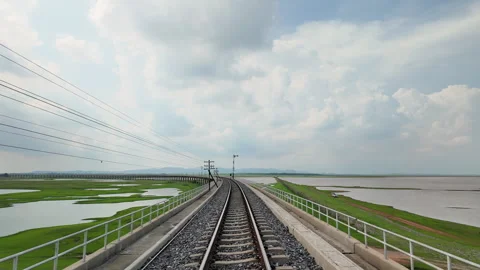 Floating railway tracks over Pasak Cholasit Dam in the dry season, Stock Footage 275843591
