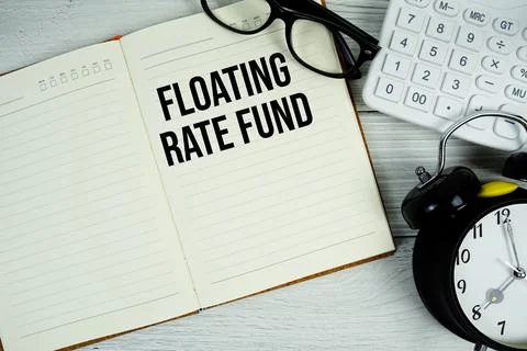 Floating Rate Fund text on notepad with alarm clock, magnifying glass and c.. Stock Photos