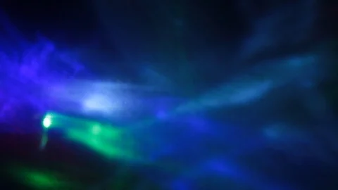 Floating rays of light in blue, green and red colors Видео 105944849