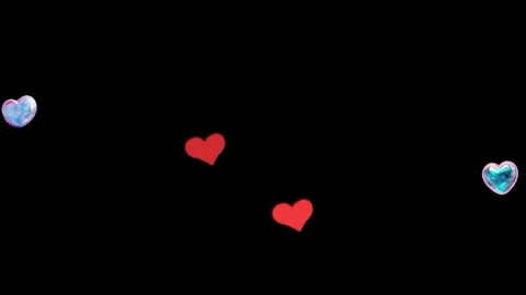 Floating red and blue heart balloons drifting gently across a dark background Stock Footage 338992611