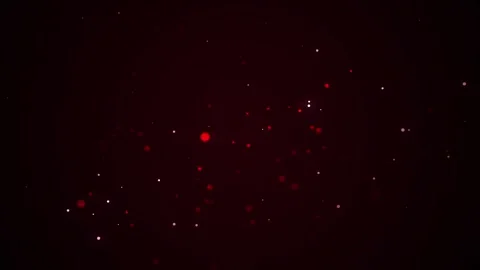 Floating red and white bokeh particles with subtle light flare on dark screen Stock Footage 312098028