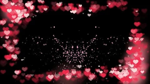 Floating red heart bokeh particles creating glowing shapes against deep black Stock Footage 343551482