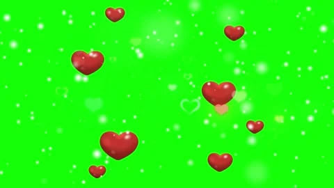 Floating red hearts and glowing particles on a bright green chroma key Vídeo Stock 338388224