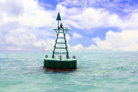 Floating red navigational buoy in open sea Stock Photos