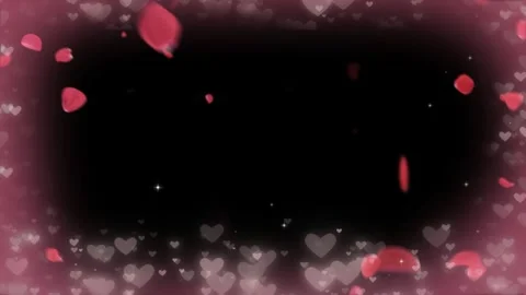 Floating red rose petals falling through glowing heart shapes against dark Stock Footage 345335225