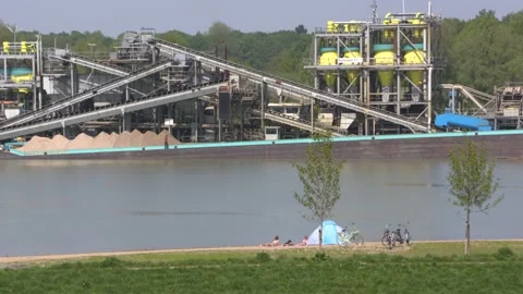 Floating sand classification plant loading a vessel with sand Stock Footage 130257444