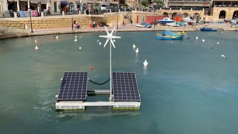Floating Sea bin, solar panels and tiny wind turbine.  St Julian's, Malta Stock Footage 259879863