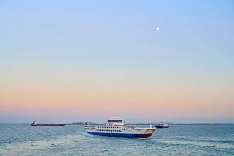 Floating on the sea ferry at sunset Stock Photos