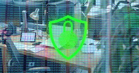 Floating shield icon displaying padlock hovering over office desk with Foto stock