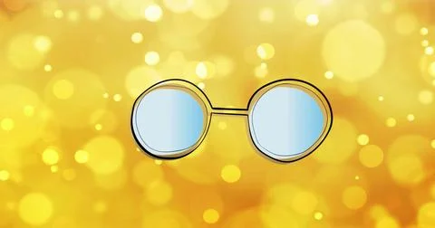 Floating single pair of round glasses with gold frames and blue lenses against 库存照片