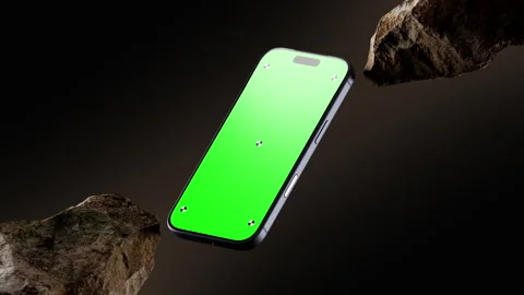 Floating Smartphone Green Screen Mockup With Rocks On Dark Background Stock Footage 344625256