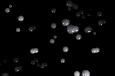 Floating soap bubbles filled with smoke on black background. Stock Photos