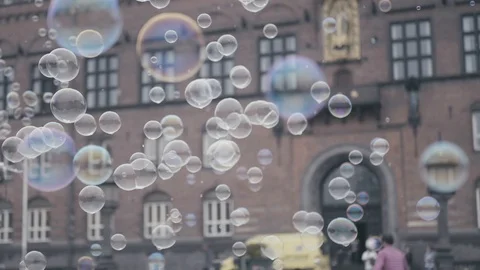 Floating soap bubbles in front of a Copenhagen building. Stock Footage