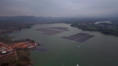 Floating solar panels dot calm lake waters Stock Footage 346258230