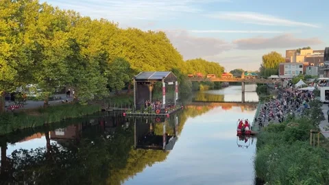 Floating stage and crowd gathered along the Ems River embankment during a s.. Stockbeeldmateriaal 346297779