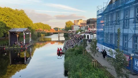 Floating stage and crowd gathered along the Ems River embankment during a s.. Stockbeeldmateriaal 346297912