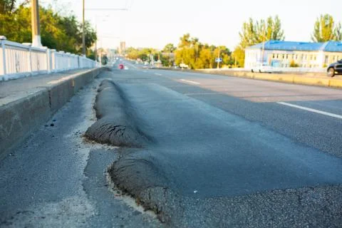 Floating substandard asphalt. Poor quality road a 写真素材