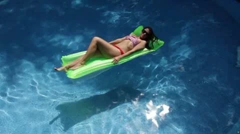 Floating Sunbather Stock Footage 22771929