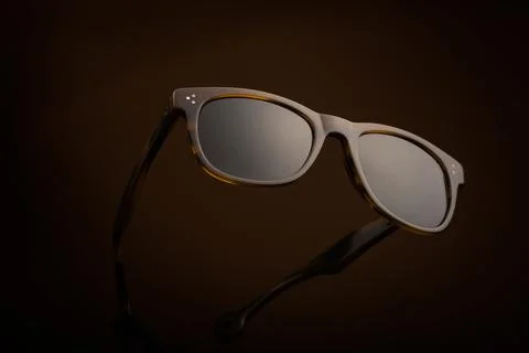 Floating Sunglasses on a Brown Background Stock Photos