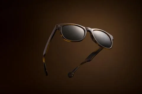 Floating Sunglasses on a Brown Background Stock Photos