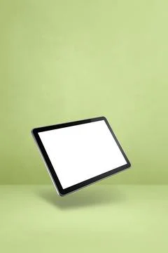 Floating tablet pc computer isolated on green. Vertical background Stock Illustration