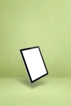 Floating tablet pc computer isolated on green. Vertical background Stock Illustration