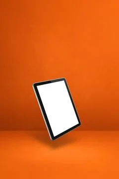 Floating tablet pc computer isolated on orange. Vertical background Illustrazione stock