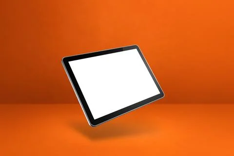 Floating tablet pc computer isolated on orange. Horizontal background Illustrazione stock