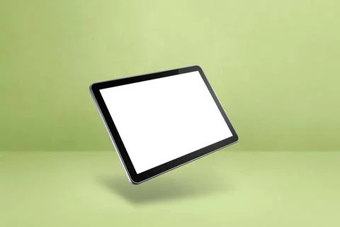 Floating tablet pc computer isolated on green. Horizontal background Blank... Stock-Fotos