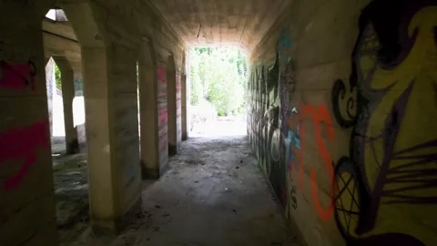 Floating through an abandoned mine building with graffiti Stock Footage 243607879