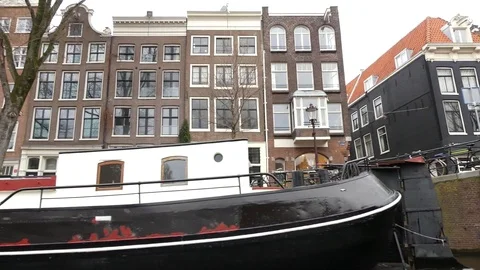 Floating through Amsterdan canals Stock Footage 72380632