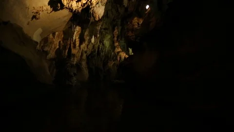 Floating Through Creepy Dark Cave Filled With Stalactites 스톡 동영상 125784057