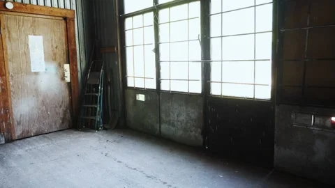 Floating through garage past tools, work benches and junk Stock Footage 195999666