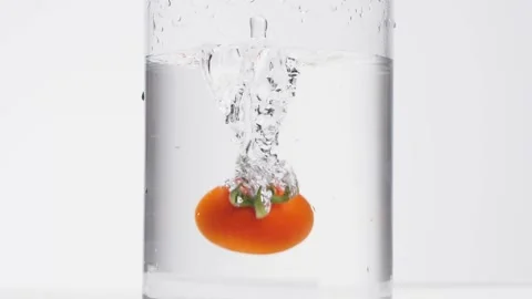 Floating tomato in the water Stock Footage 132861356